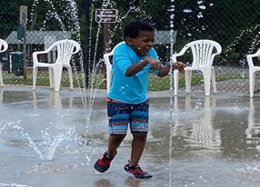 child plays in water